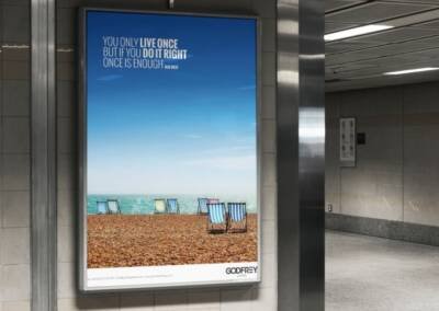 Godfrey Living Advertising billboard showing deckchairs on beach