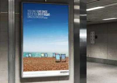 Godfrey Living Advertising billboard showing deckchairs on beach