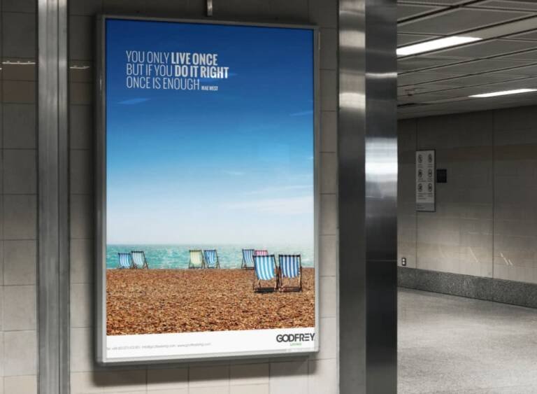 Godfrey Living Advertising billboard showing deckchairs on beach