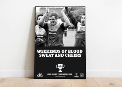 Wellington Rugby Jubilee Cup Poster showing muddy players cheering and yelling
