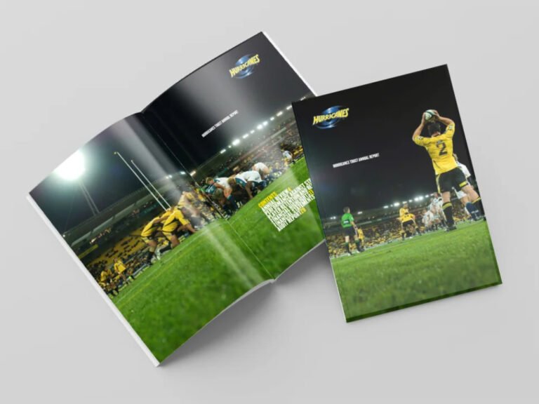 Picture shows fthe front cover and double page spread from the Hurricanes Annual Report