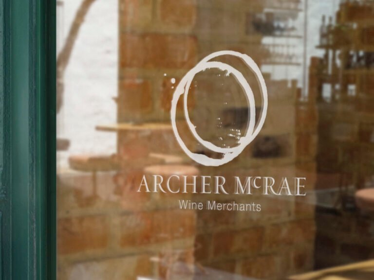 Archer McRae logo with wine stain circle