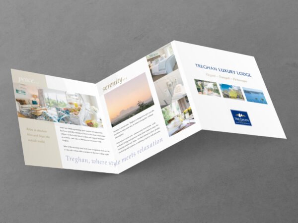 Tregahan luxury lodge brochure on textured surface.